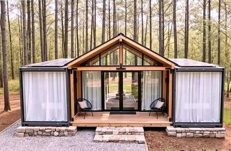 The Canopy container home with a glass gable great room and solar panels